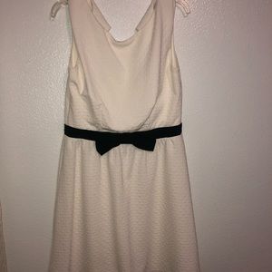 White and black formal dress with bow